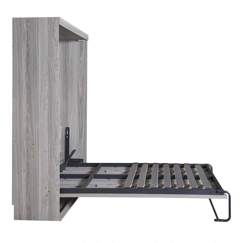 Le lit escamotable en bois peut être replié dans un meuble.