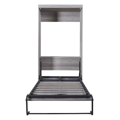 Le lit escamotable en bois peut être replié dans un meuble.