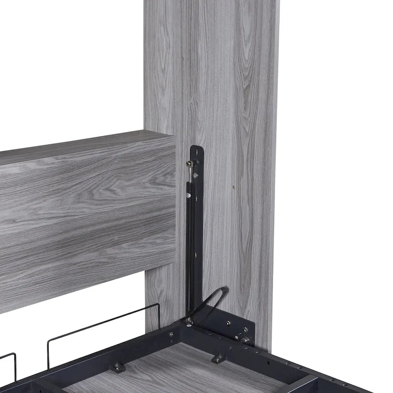 Le lit escamotable en bois peut être replié dans un meuble.